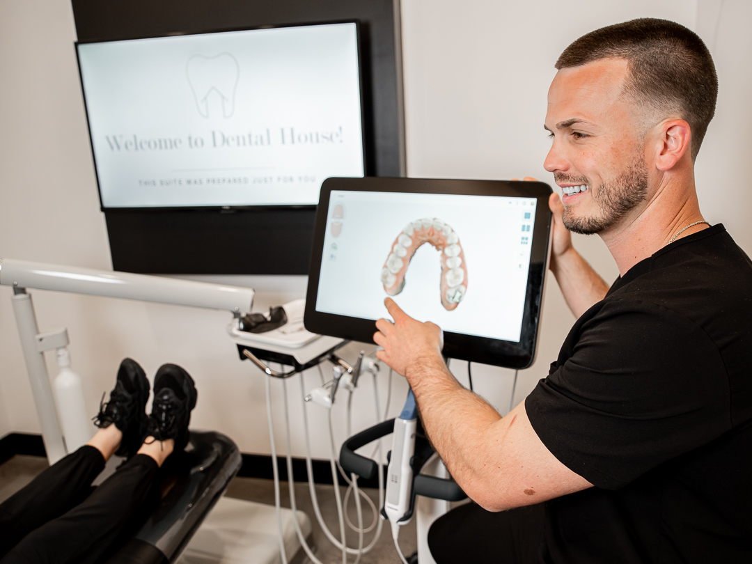 Dr. Kye reviewing a digital scan with a patient